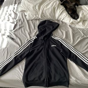 A black Adidas zip up hoodie